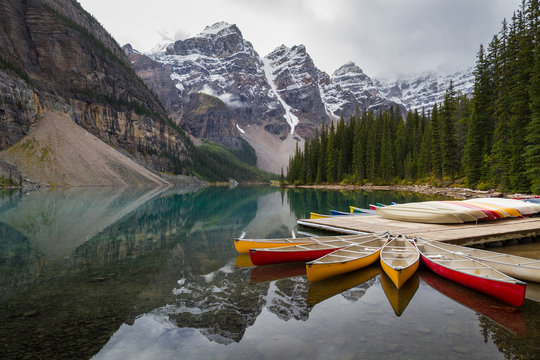 Colorful canoes at Moraine Lake in Banff National Park Alberta Canada