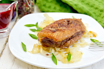 Duck breast whole with cabbage and green onions in plate