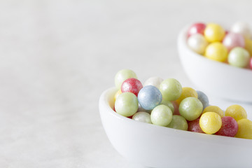 Colourful Sugar Pearls on White Spoons, Horizontal, Selective Focus, Copy Space