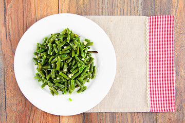 Green Beans Fried with Garlic on a White Plate.