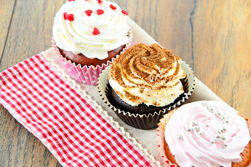 Cake with Cream, Cupcake on Woody Background.