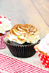 Cake with Cream, Cupcake on Woody Background.