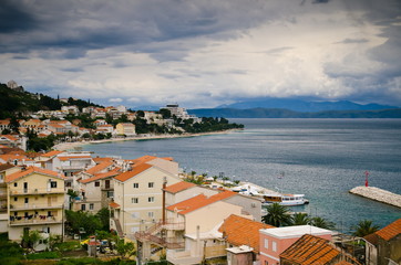 rainy sky over the city. coastal town, the house by the sea, ended the holiday season,  tourist town in winter. Bosnia and Herzegovina, Croatia
