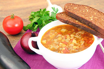Lentil soup with eggplant, tomatoes and onions