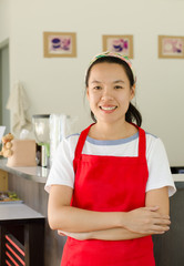 Portrait of woman barista in the coffee shop