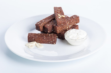 roasted garlic croutons, sour cream on a white background