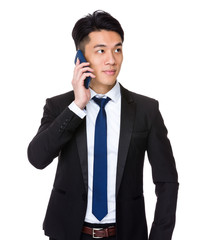 Asian Businessman talk to smart phone