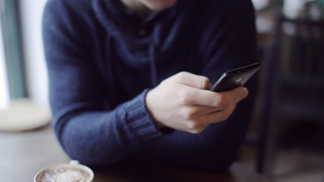 smart phone in male hands closeup