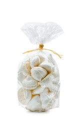 French white meringues in a cellophane bag, isolated on white background - obrazy, fototapety, plakaty