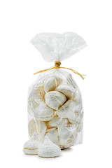 French white meringues in a cellophane bag, isolated on white background