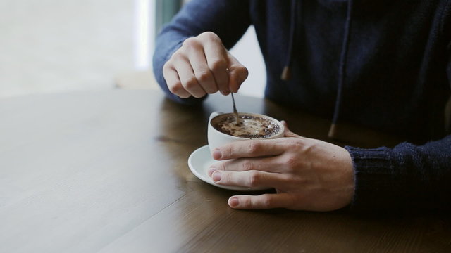 cup of coffee in male hands