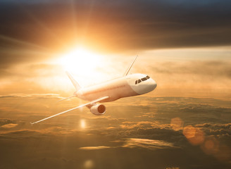 Fototapeta na wymiar airplane during sunset/sunrise