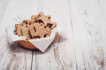 Christmas ginger cookies on wooden background