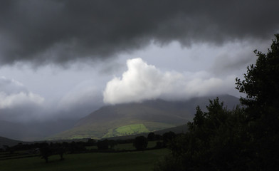 Scenic view of Kerry Mountains in thunderclouds 