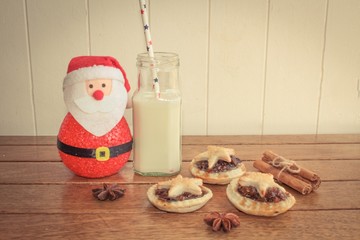 Handmade mince pies and a glass of milk, traditionally left out for Father Christmas on Christmas Eve