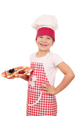 happy little girl cook with delicious crepes