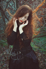 Fototapeta premium Red hair woman in soft sunset light