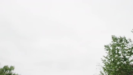 Happy young Asian woman running and jumping over camera at the park
