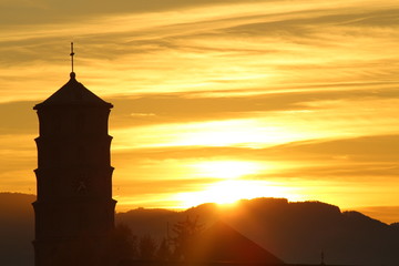 Mariahilf parish church (originally Pfarrkirche Mariahilf or Heldendankkirche) tower at sunset on Mariahilf Street in Bregenz, Vorarlberg, Austria.