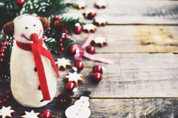 Winter decoration with snowman, christmas tree and cookie stars
