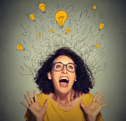 excited happy screaming woman with many light idea bulbs above head