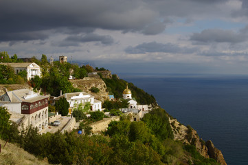 Fototapeta na wymiar view of St.George's monastery on slope of mountain, cape Fiolent, Crimea, Russia