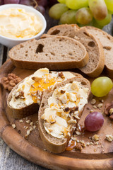 bread with butter, honey and nuts, vertical