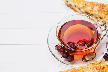 Tea from a dogrose with a slice of cake and space for text