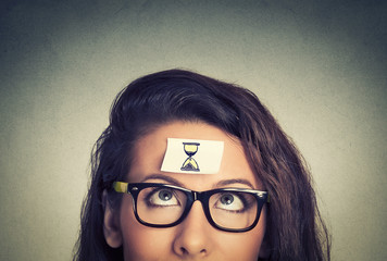 Time management concept young woman with sand clock sign