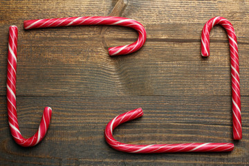 yummy Christmas candy on wooden brown background
