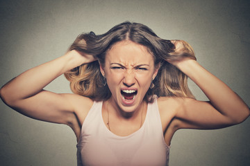 frustrated angry woman pulling hair out yelling screaming - obrazy, fototapety, plakaty