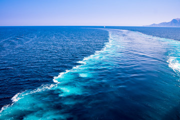 The wake of a boat as seen from the stern of a ship on Mediterranean sea