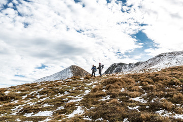 walking couple in carpathian mountains