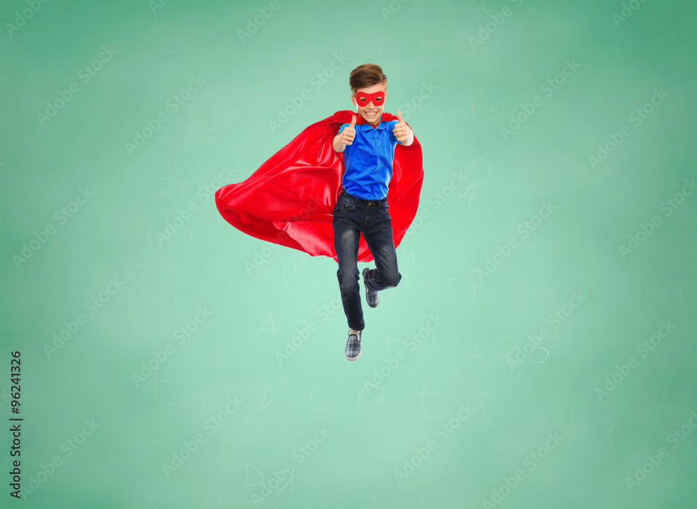 Poster boy in super hero cape and mask showing thumbs up