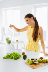 Obraz na płótnie Canvas Healthy Diet. Closeup Of Smiling Young Woman With Blender Chopping Vegetables For Green Detox Raw Smoothie Juice. Healthy Eating. Vegetarian Food, Dieting.