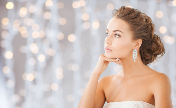 Fototapeta beautiful woman wearing shiny diamond earrings