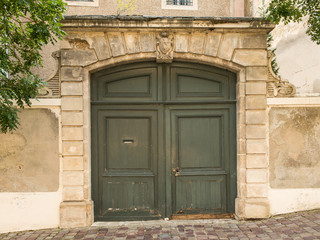 Antique historical brown door in France Europe