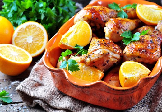 Baked chicken drumstick with orange, smoked paprika, Provencal herbs and olive oil.