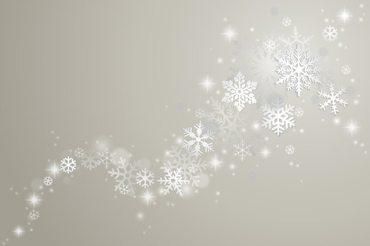 Winter background with swirl of snowflakes and snow on grey