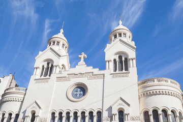 Beautiful white building of church against blue sky and cloudscape