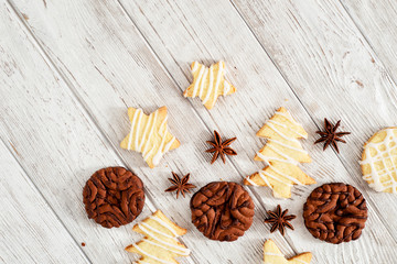 Christmas mood , festive cookies with cocoa and cinnamon on a wooden background