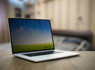 laptop on table in the bedroom