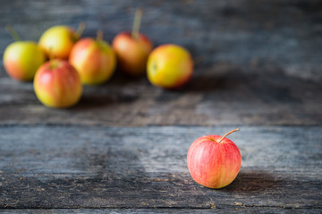Apples on old wooden background.