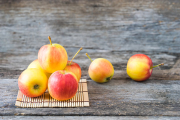 Apples on old wooden background.