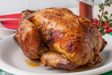 Baked chicken on white plate. © Arkadiusz Fajer