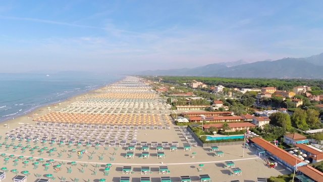 Aerial : flying over the beach sunny day Tuscany Italy
