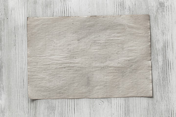 paper on wooden background