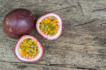 Ripe passion fruit isolated on old wood background.