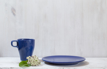 mug and plates on table