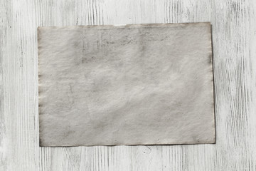 paper on wooden background